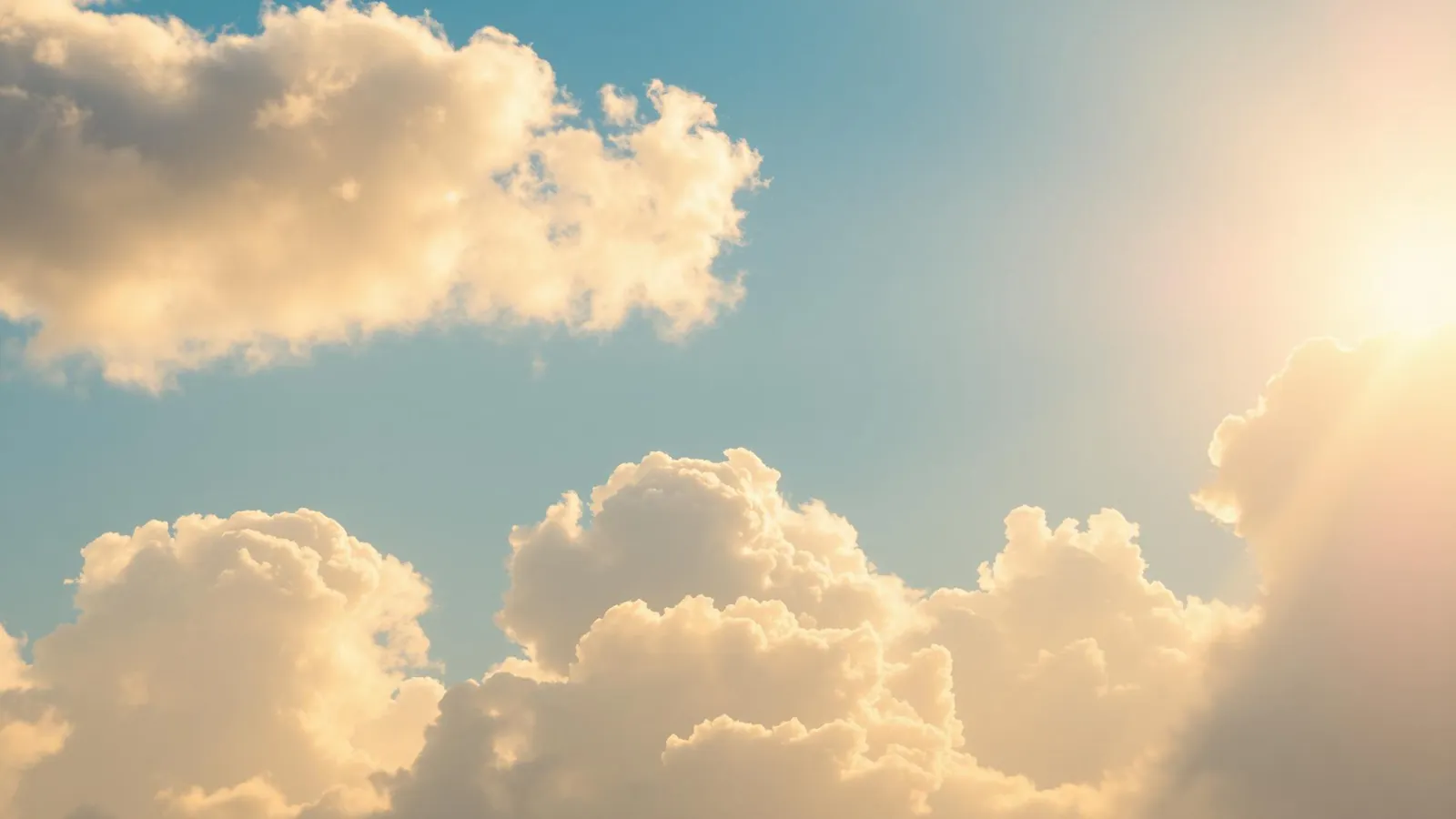 Warm sunny sky with golden clouds
